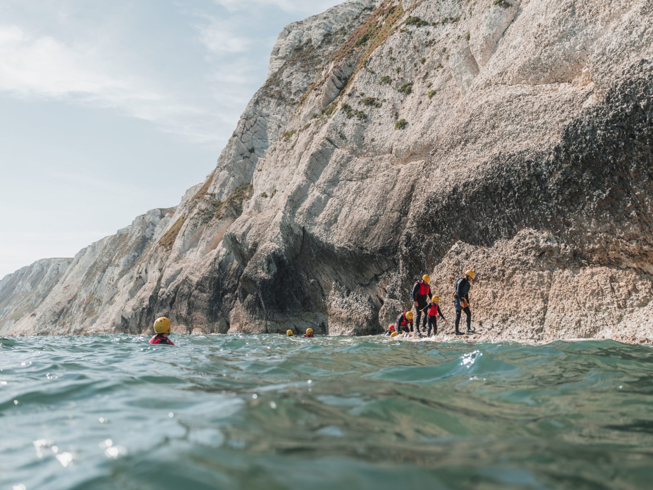 a body of water with a mountain in the background