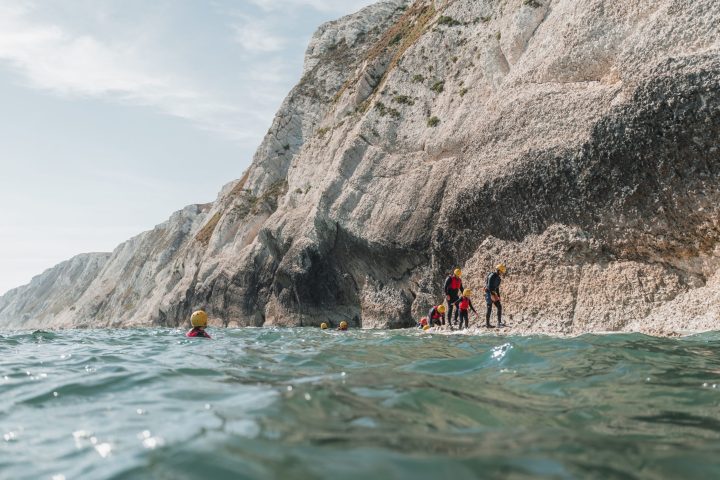 a body of water with a mountain in the background