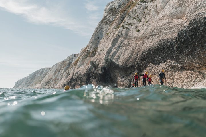 a man riding a wave on top of a mountain