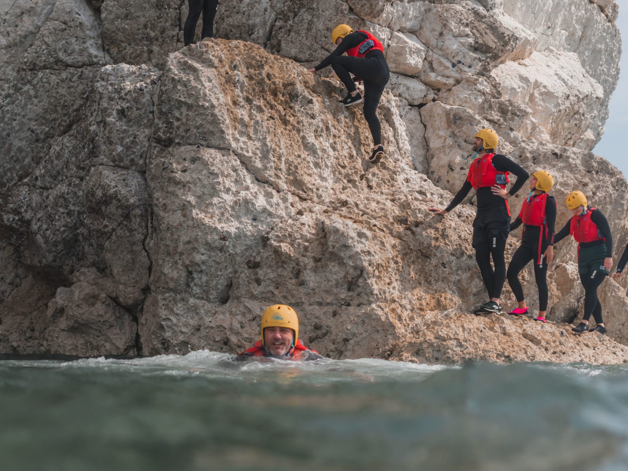 a group of people on a rock