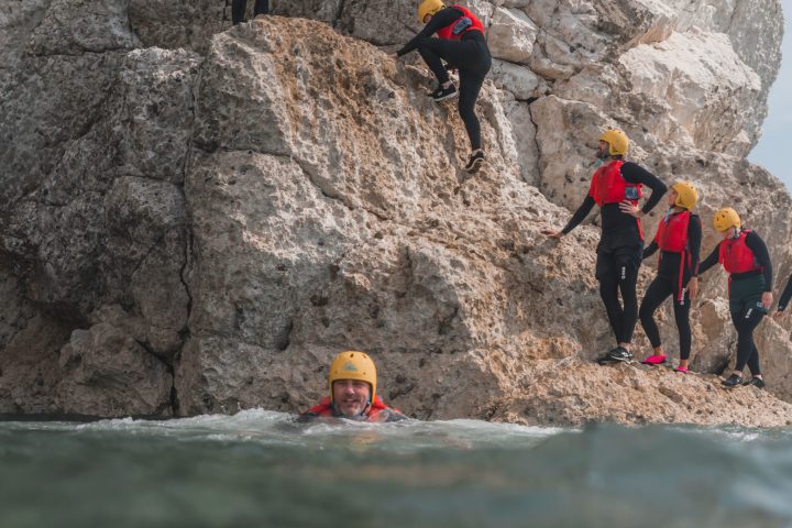 a group of people on a rock