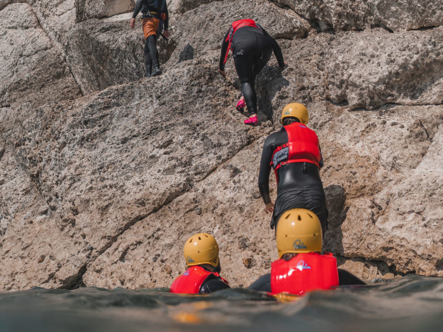 a person sitting on a rock
