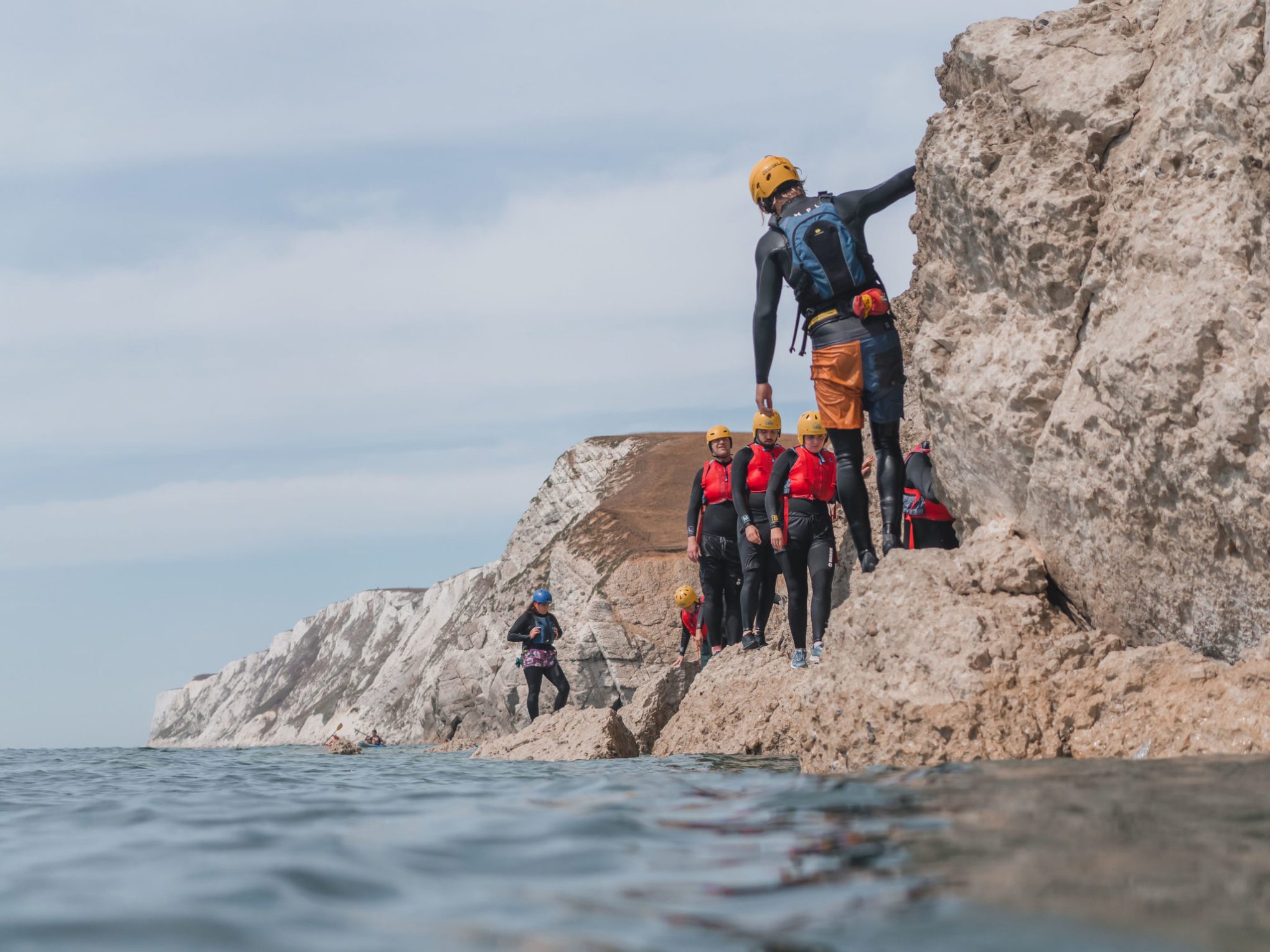 a group of people on a rocky hill