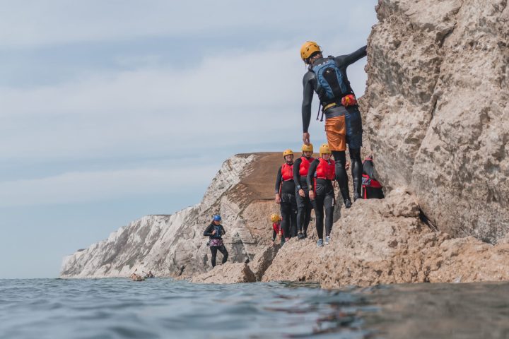 a group of people on a rocky hill