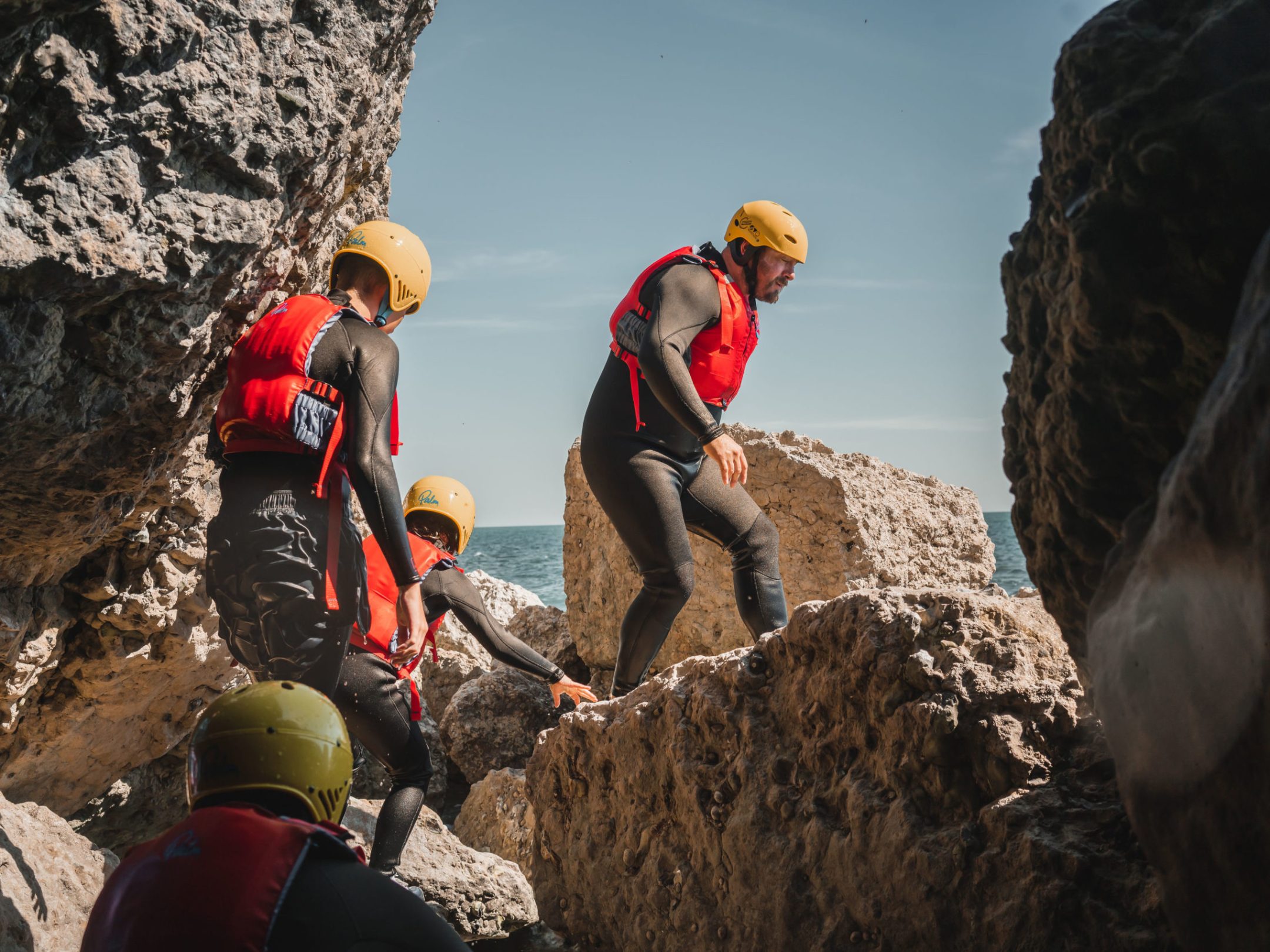 a group of people on a rocky hill